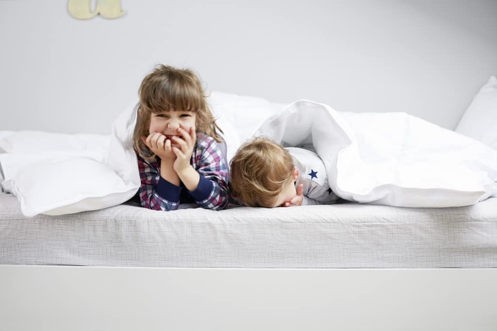 child sleeps on air mattress