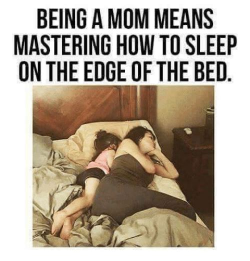 being a mom means mastering how to sleep on the edge of the bed